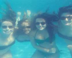 She is a good swimmer and likes to chill out in a pool with her besties.